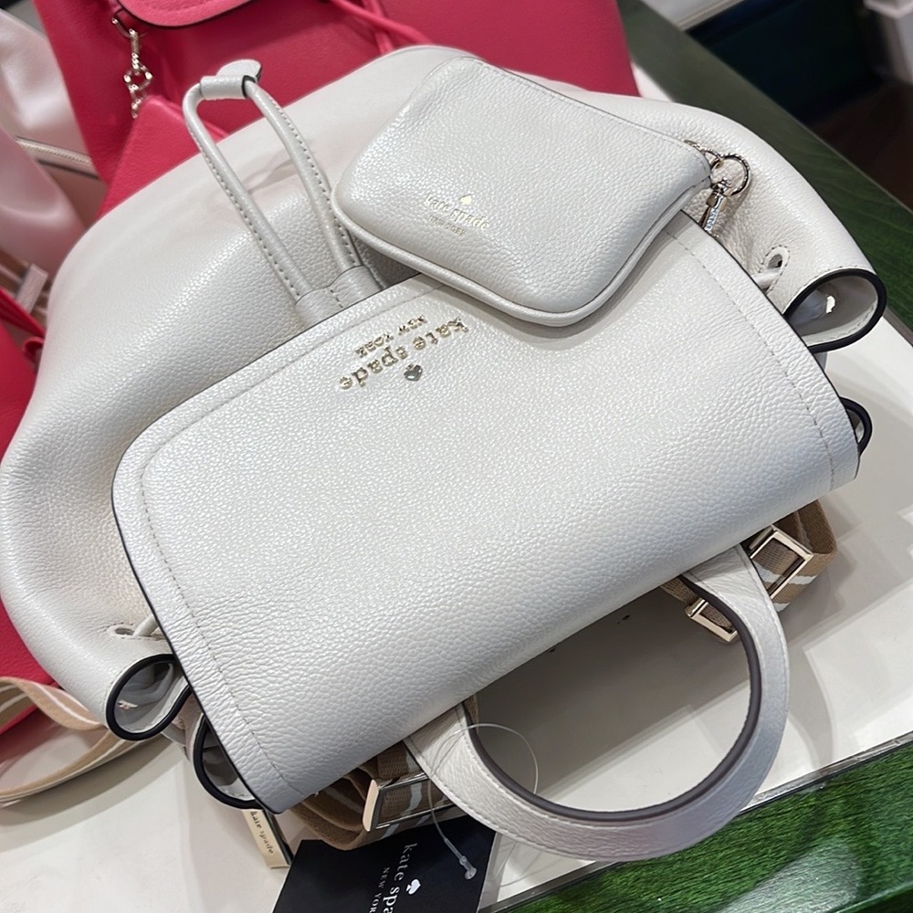 Kate Spade Rosie Medium Flap Backpack 
K8714 pebbled leather Parchment rosie
NWT - Picture 9 of 16